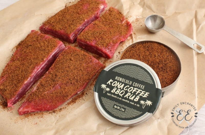 Open tin of Honolulu Coffee Kona Coffee BBQ Rub with flank steak and measuring spoon