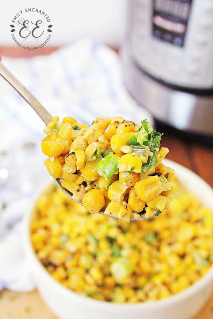 Instant Pot Mexican Street Corn Off the Cob on a serving spoon