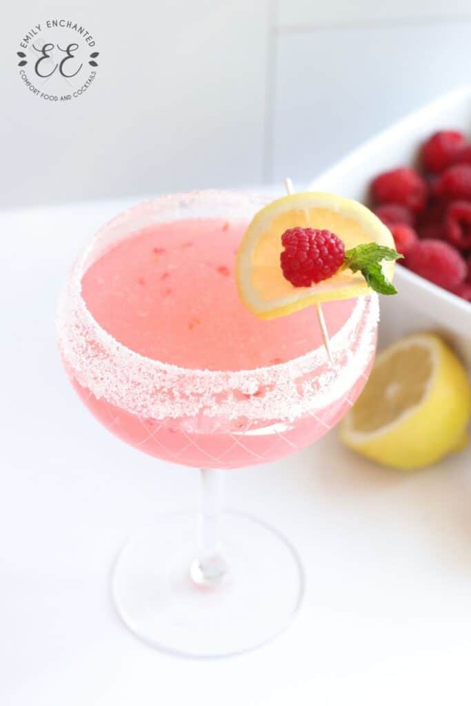 Raspberry Cocktail with Lemon Garnish