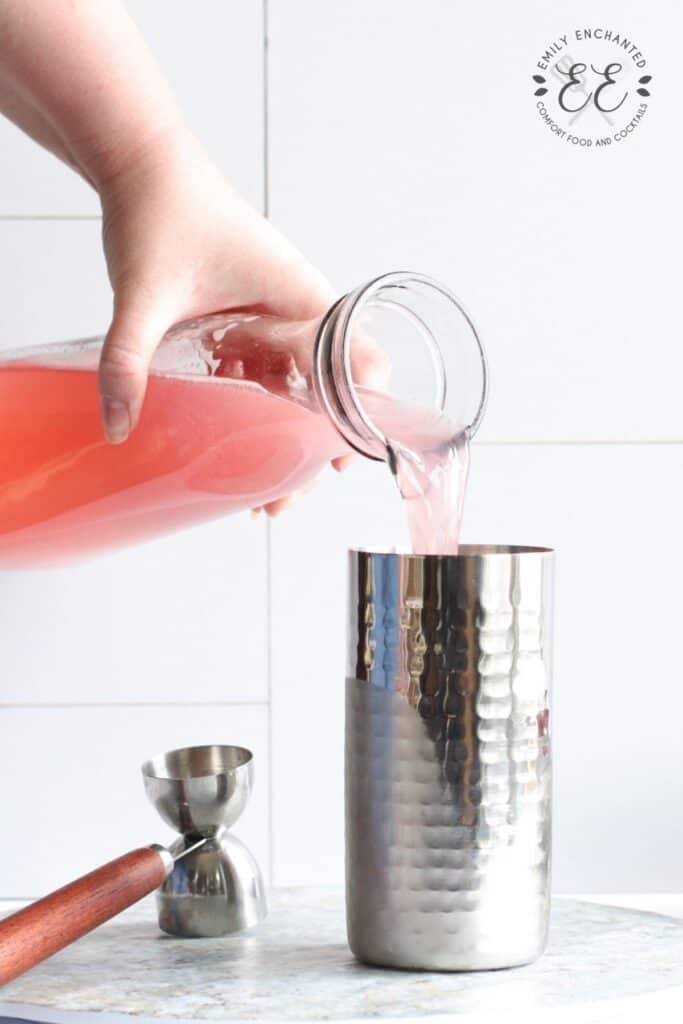 Raspberry Lemonade being poured into a cocktail shaker