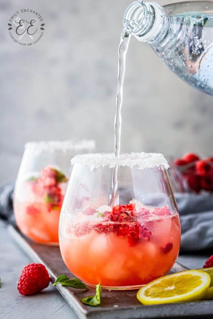 Vodka Cocktail with Club Soda Club soda being poured into a cocktail