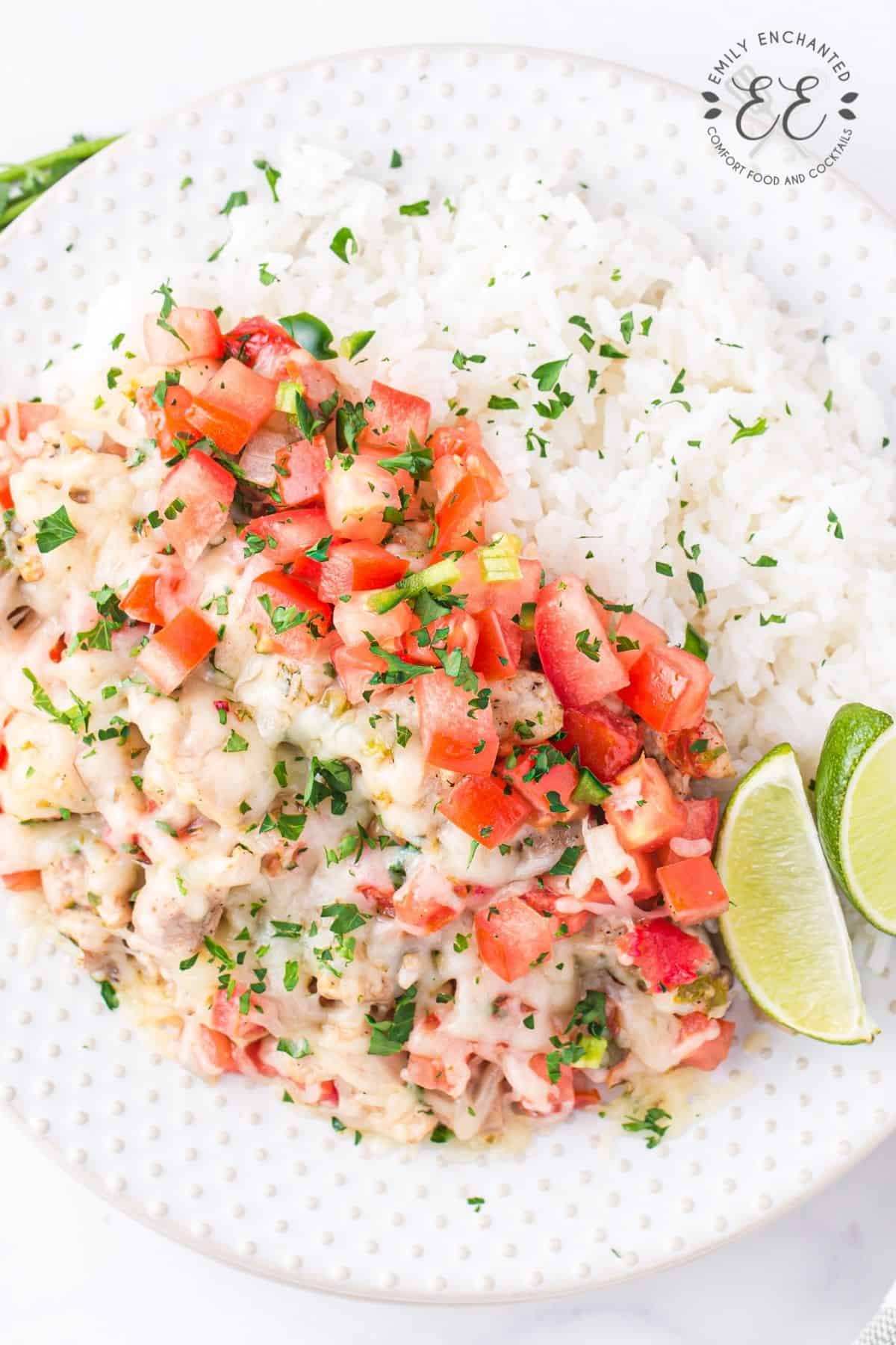 Salsa Chicken Recipe on a plate with rice and lime wedges