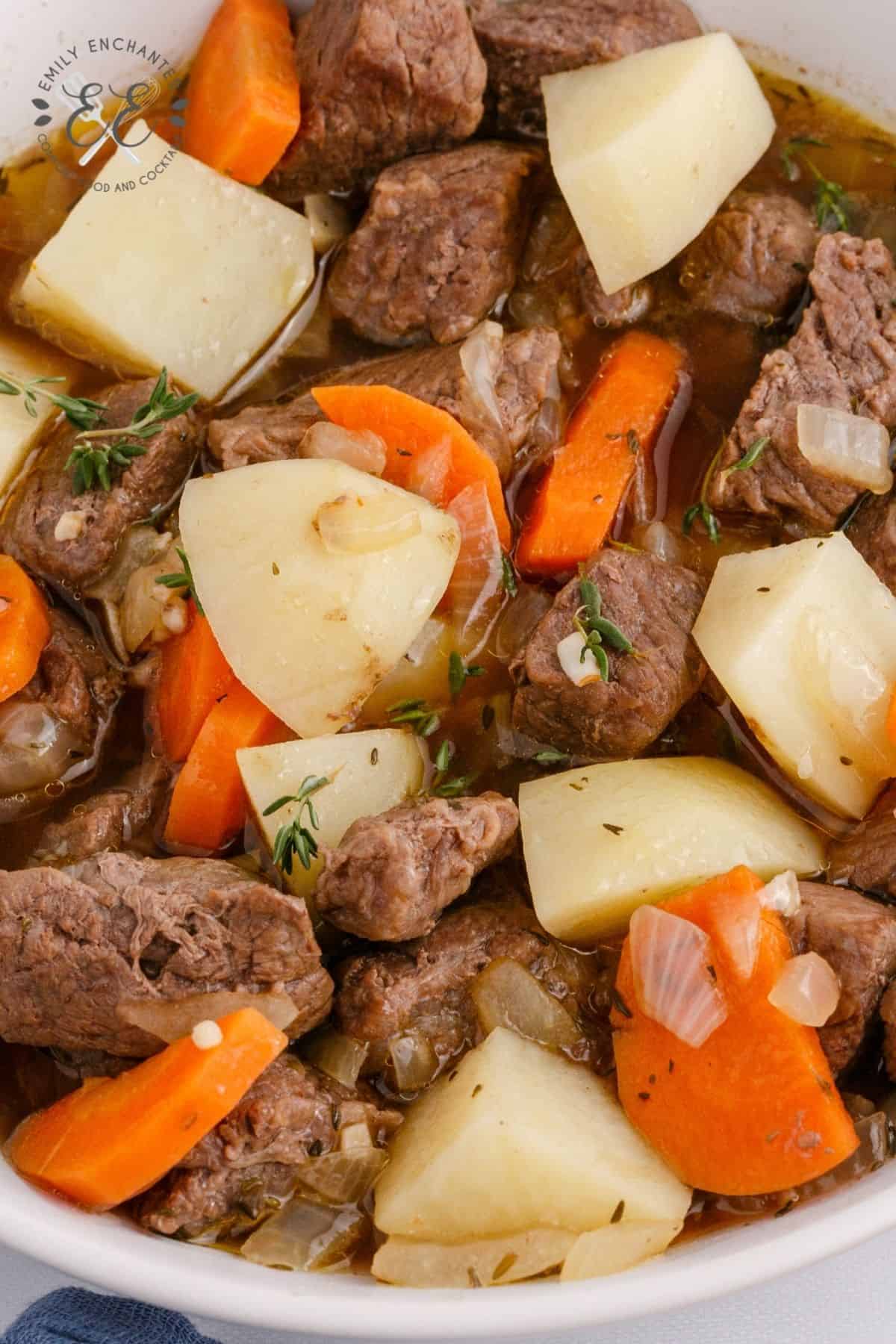 Bowl of beef stew with potatoes, onion and carrots