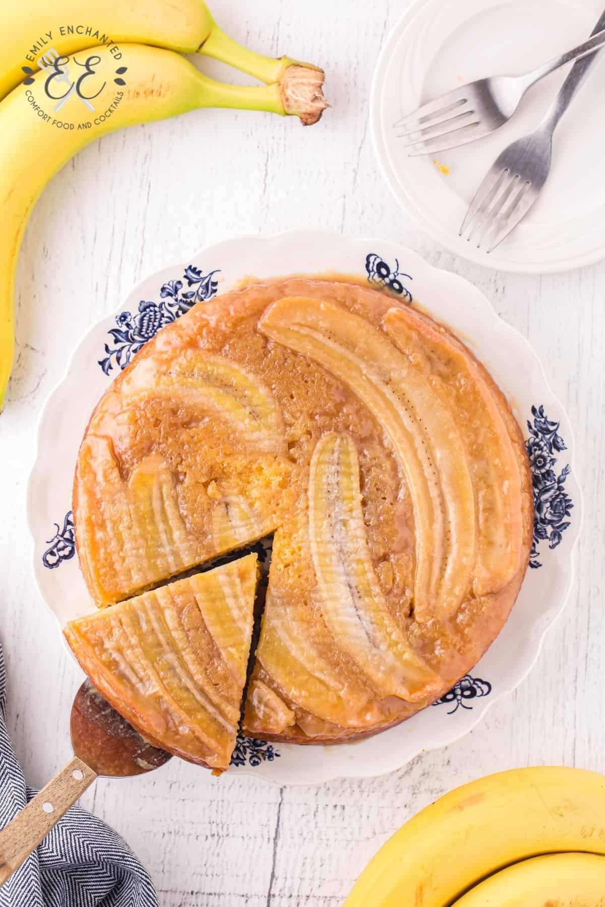 Banana Upside Down Cake with a slice being cut out