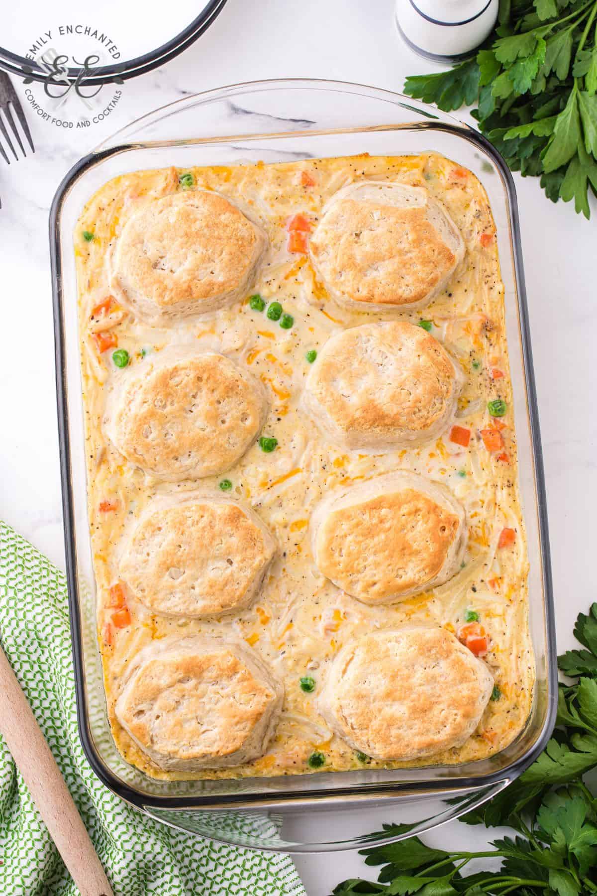 Chicken pot pie casserole with biscuits in a casserole dish