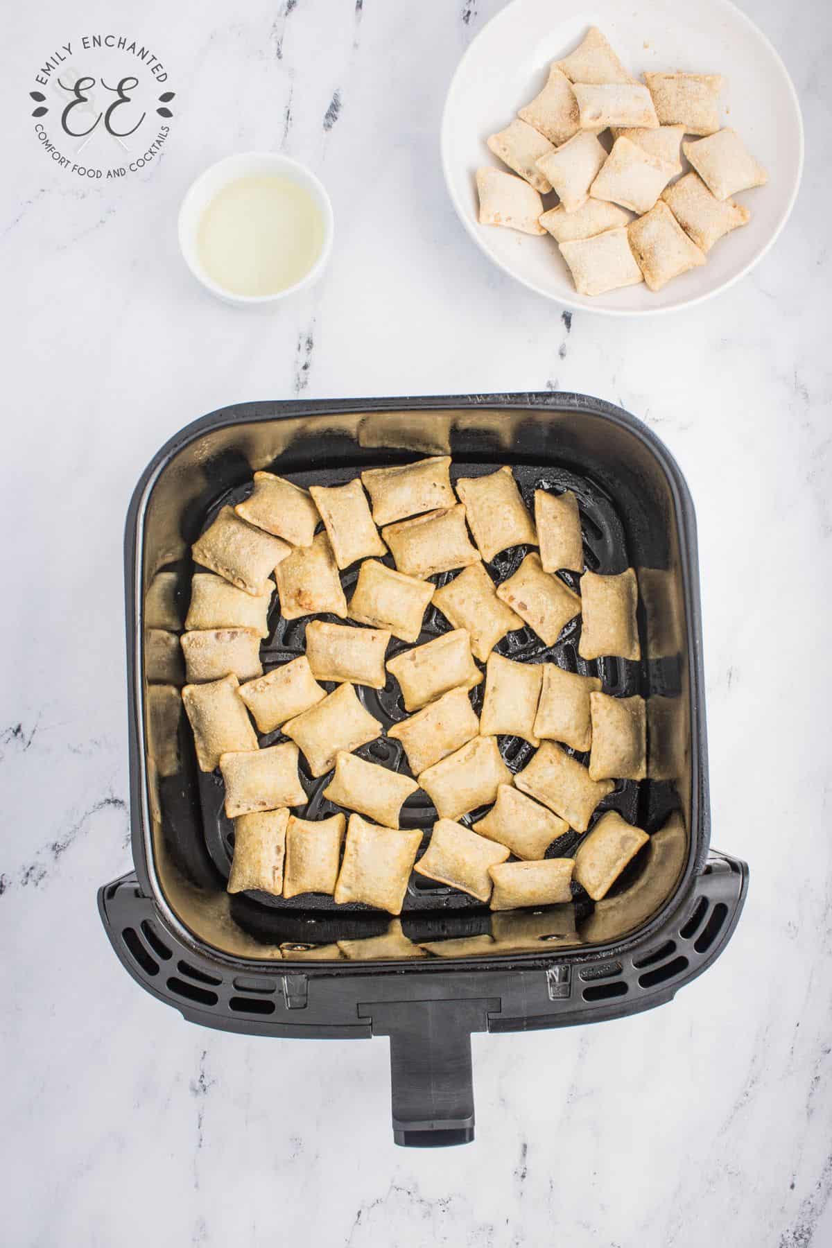 Pizza Rolls in an air fryer basket