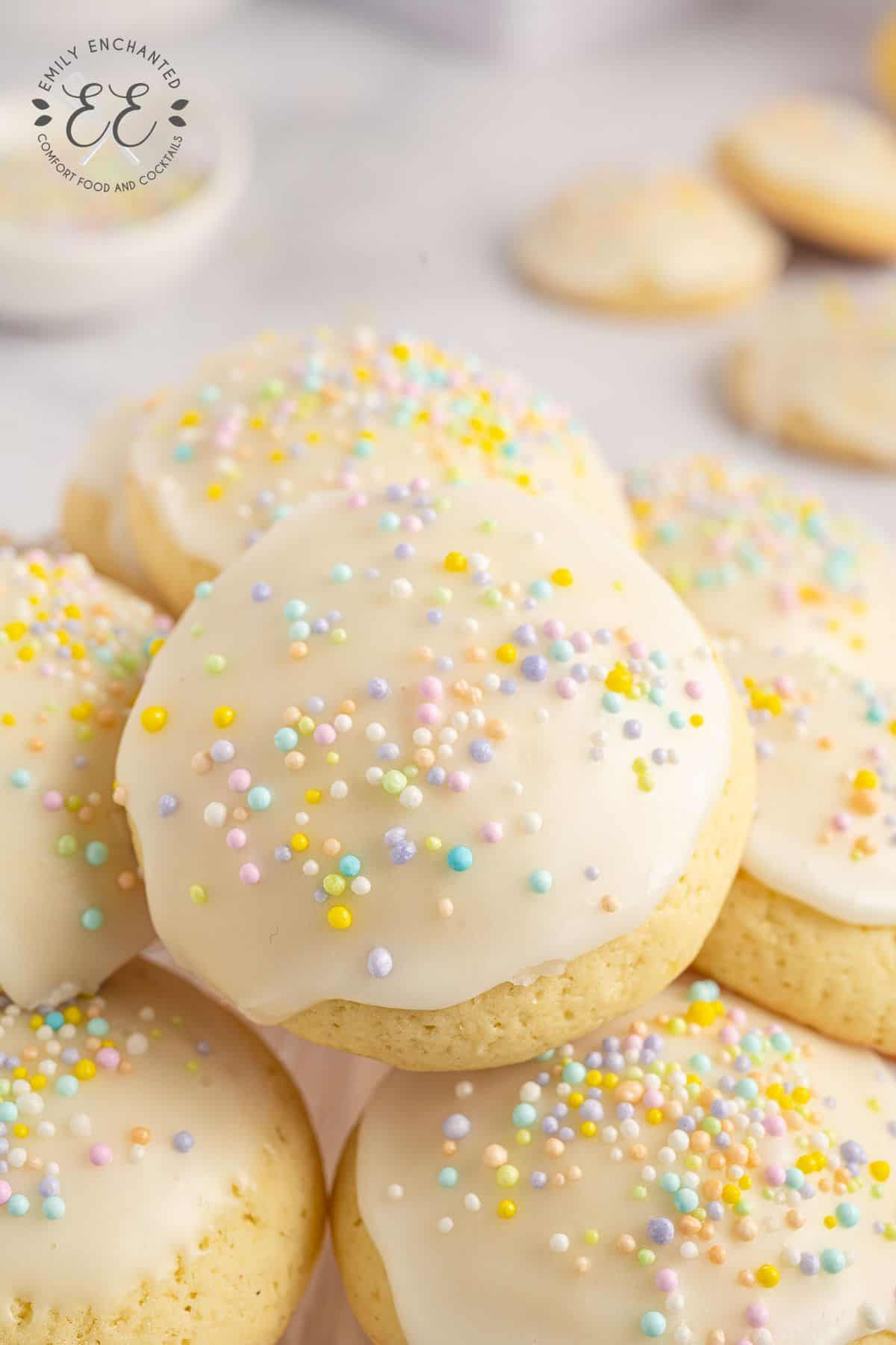 pile of Italian Easter Cookies with icing and pastel sprinkles