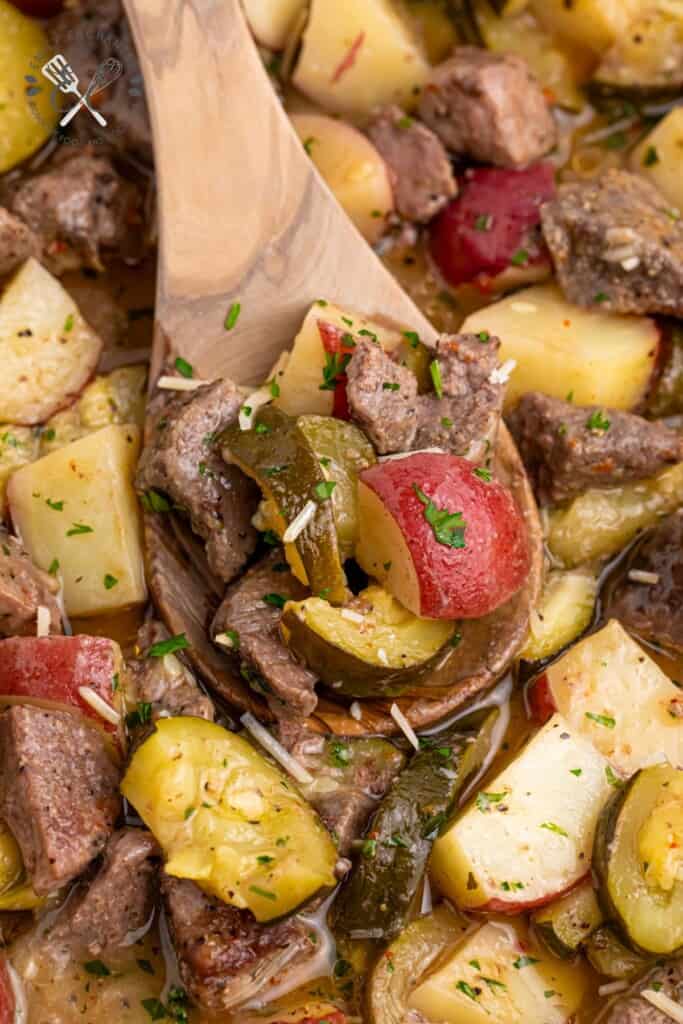 One Pan Italian Steak Bake on a wooden spoon